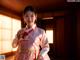 A woman in a pink hanbok is posing for a picture.